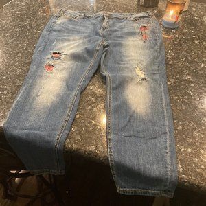 Distressed Lane Bryant jeans with red plaid accents